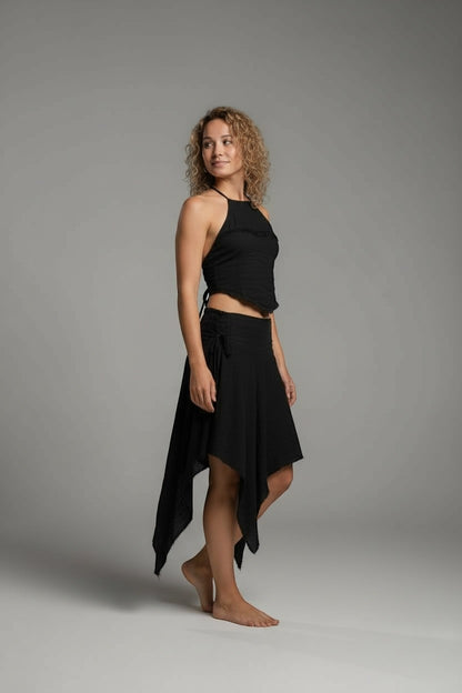 Goa Nomads black cotton gauze skirt with a flowing, asymmetrical hem and drawstring detail.