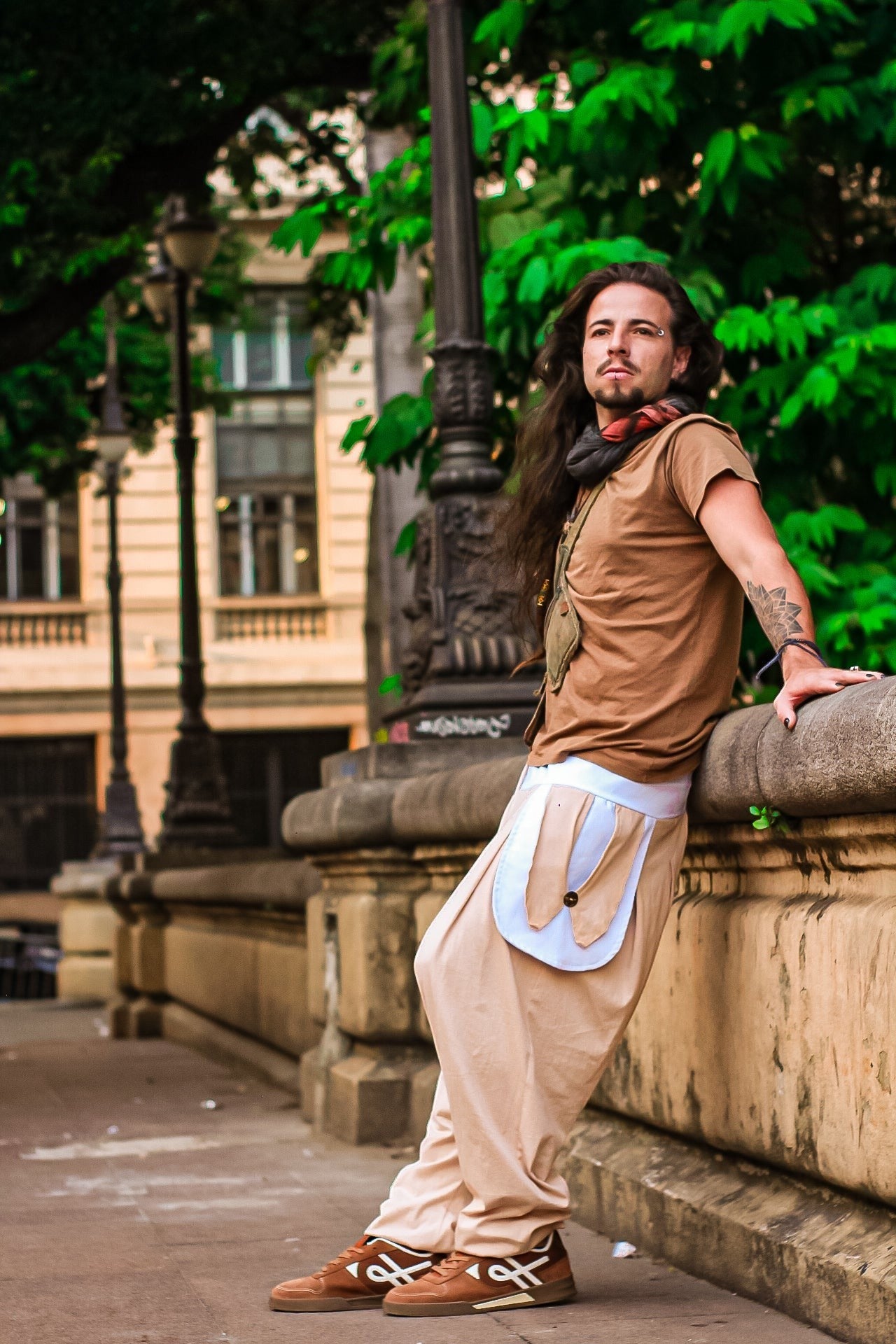 Goa Nomads beige linen blend pants with white pocket details and drawstring waist, paired with a brown t-shirt.