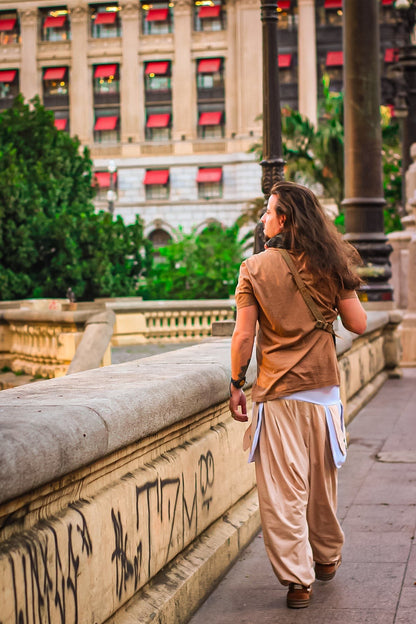 Goa Nomads beige linen blend pants with white accents, drawstring waist, and spacious pockets. Comfortable, authentic, and sophisticated style.