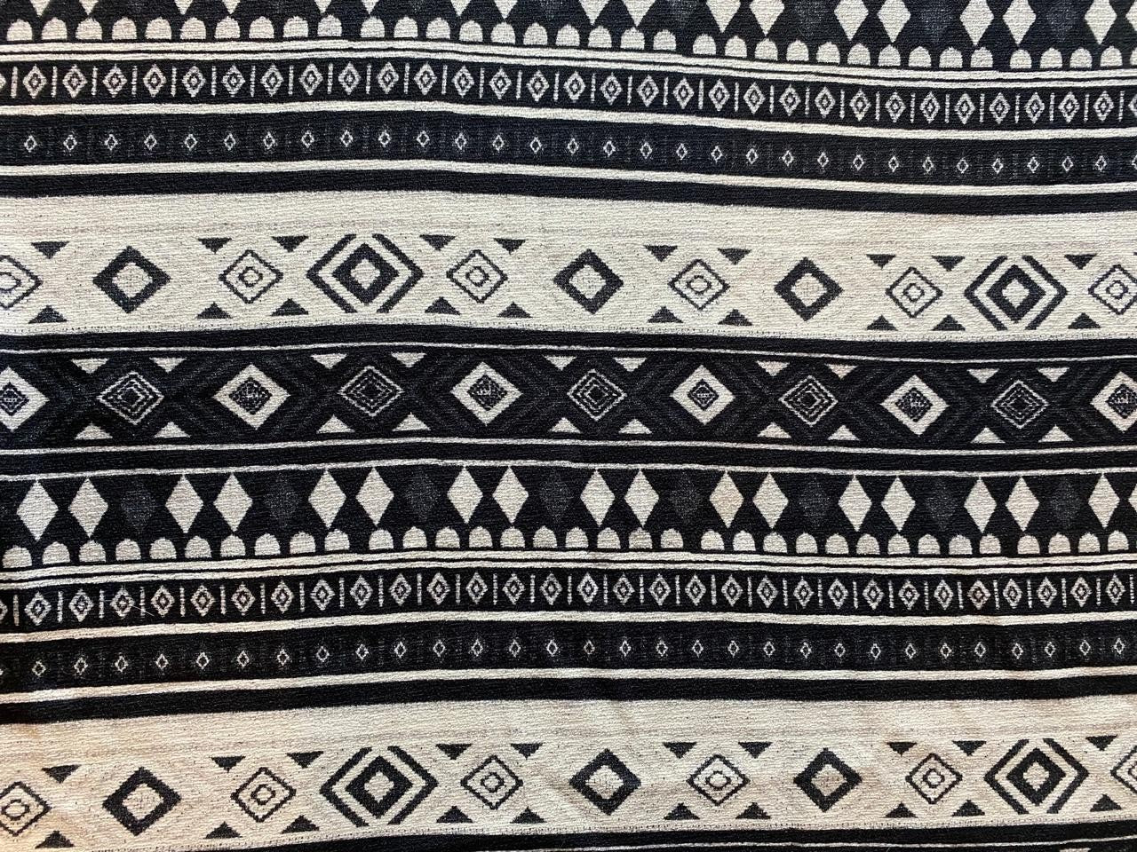 Goa Nomads black and cream tribal print cotton pants with geometric diamond and stripe patterns.