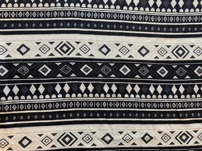 Goa Nomads black and cream tribal print cotton pants with geometric diamond and stripe patterns.
