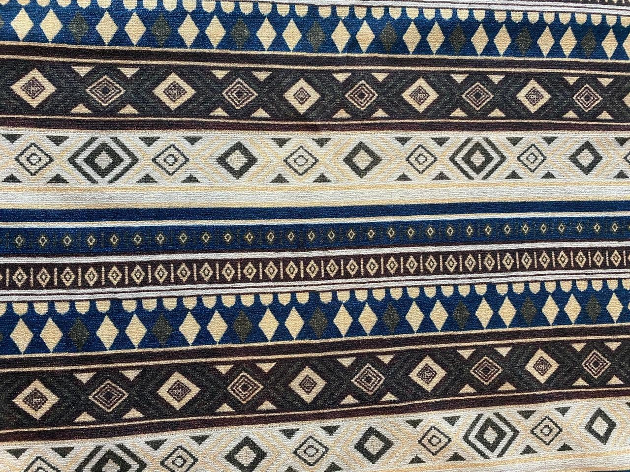 Goa Nomads Calça Hindu Ganesha pants with tribal geometric patterns in blue, beige, brown, and black.