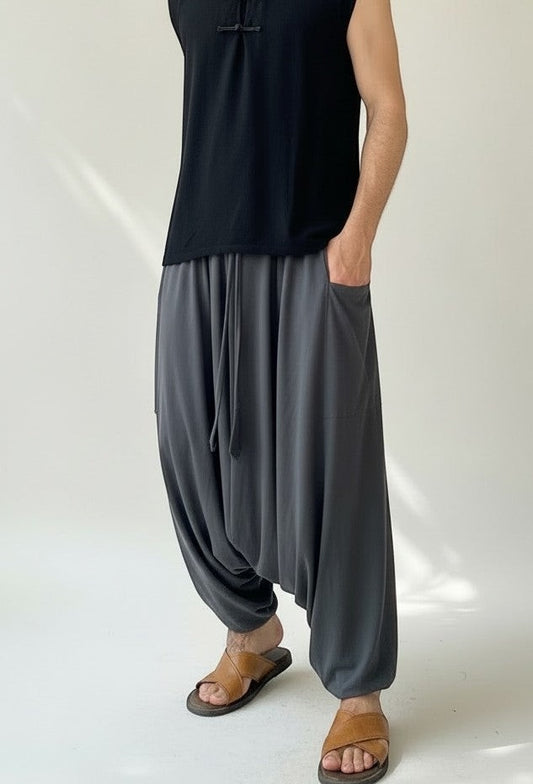 Goa Nomads charcoal grey cotton blend drop-crotch pants with drawstring waist and side pockets.