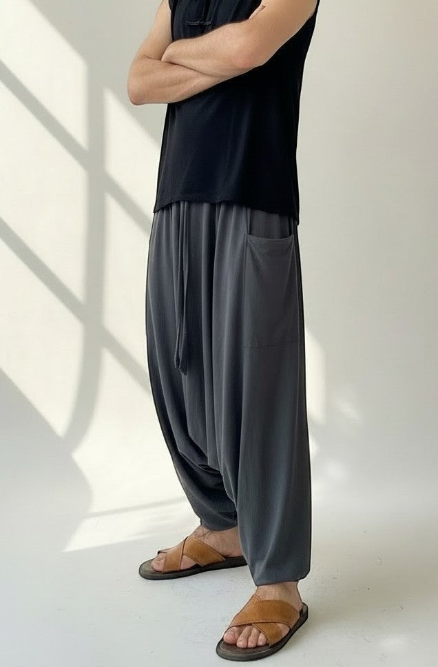 Goa Nomads charcoal grey cotton blend drop-crotch pants with drawstring waist and side pockets.
