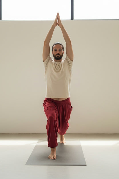 Goa Nomads men's wine-colored cotton yoga pants with a drawstring waist and side pocket.